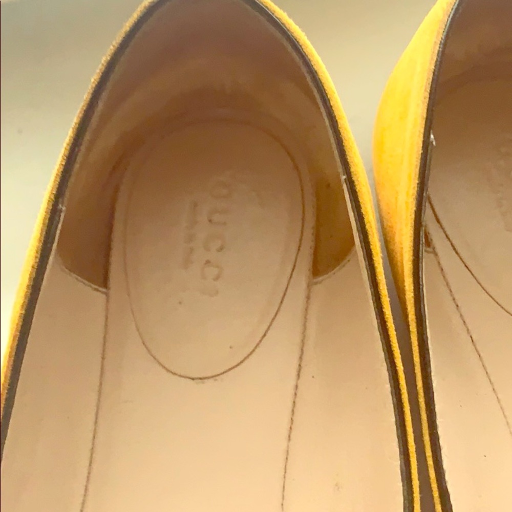 Gold/Mustard tassle double G loafers by Gucci.